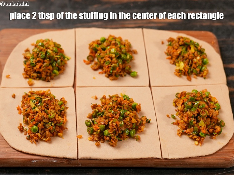 Step 25 – Place 2 tbsp of the stuffing in the center of each rectangle.
