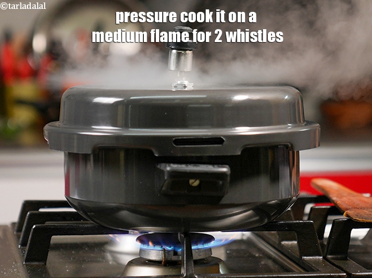 Step 25 – Pressure cook it on a medium flame for 2 whistles.