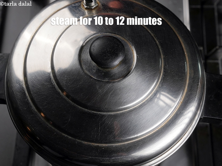 Step 30 – Steam in a steamer for 10 to 12 minutes or till the idlis are cooked.