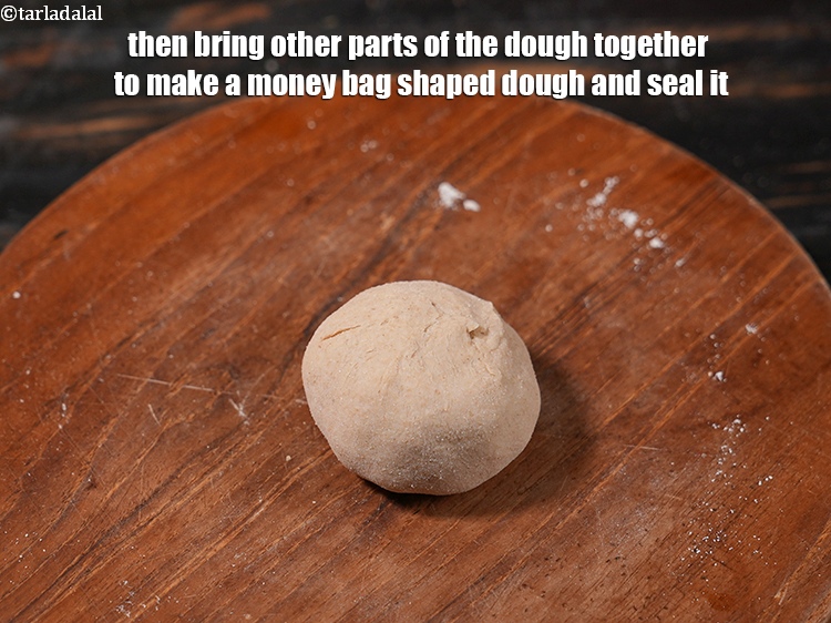 Step 28 – Then bring other parts of the dough together to make a money bag shaped dough …