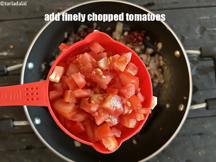 Step 25 – <html><head></head><body><p>Add&nbsp;1 1/2 cups&nbsp;finely&nbsp;<a href="glossary-chopped-tomatoes-779i">chopped tomatoes</a>.</p></body></html>
