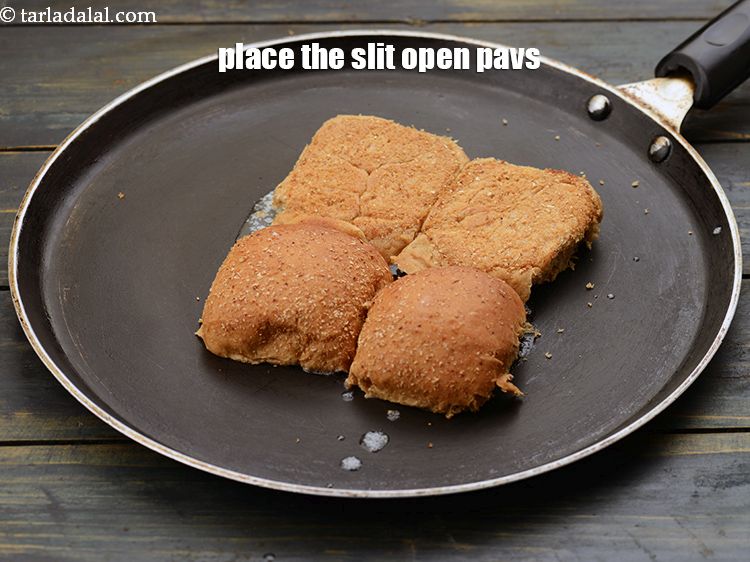 Step 30 – Place the slit open pavs on the hot tava.