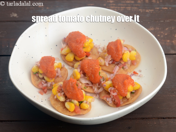 Step 31 – Spread 1&frac12; tsp of tomato chutney over it.