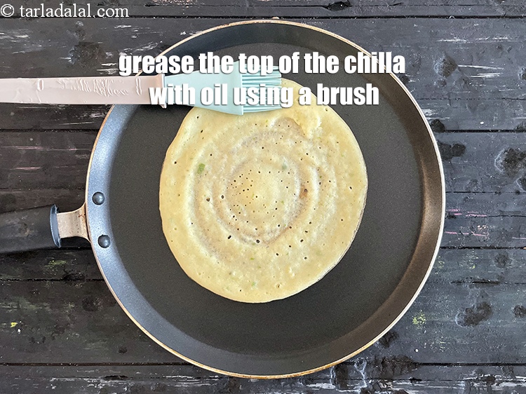 Step 34 – Grease the top of the chilla with oil using a brush.