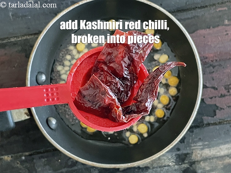 Step 25 – Add&nbsp;<meta charset="UTF-8" />1&nbsp;<a href="glossary-whole-dry-kashmiri-red-chillies-kashmiri-mirch-kashmiri-lal-mirch-332i">whole dry red chilli</a>, broken into pieces.