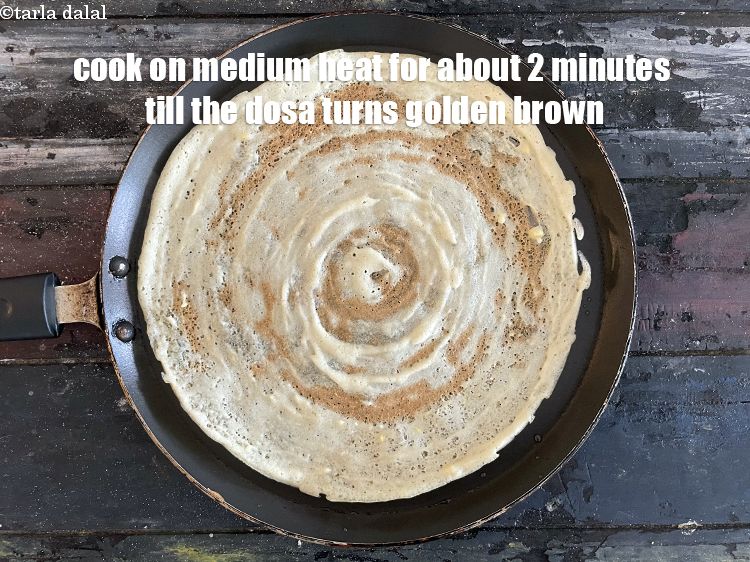 Step 30 – Cook on a medium flame for about 2 minutes till the dosa turns golden brown …