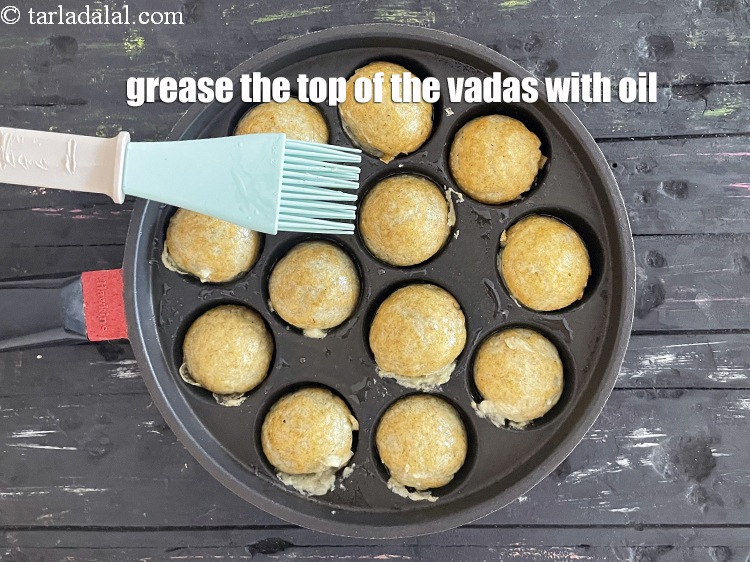 Step 25 – Grease the top of the vadas with oil.