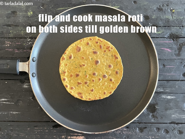 Step 25 – <meta charset="UTF-8" />Flip and cook the&nbsp;<strong>masala roti</strong>&nbsp;until golden brown in color from both sides.&nbsp;