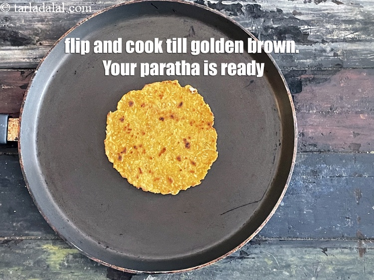 Step 26 – <meta charset="UTF-8" />Flip and cook till golden brown.&nbsp;Your paratha is ready.&nbsp;