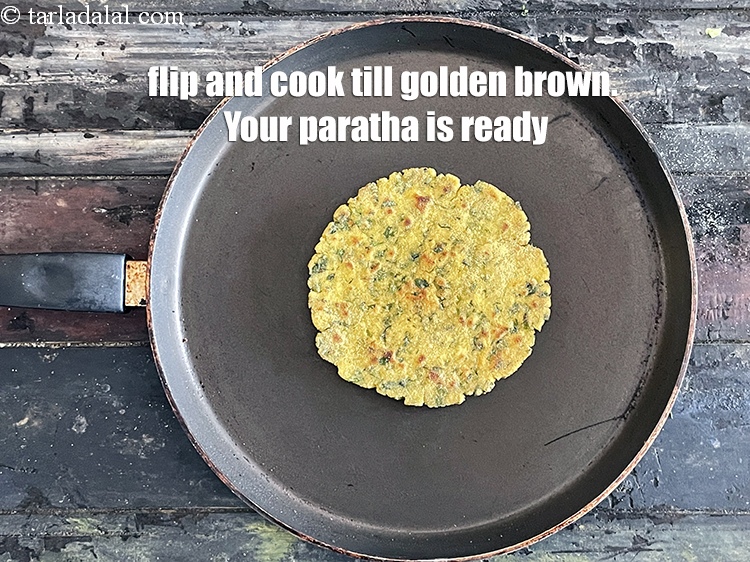 Step 25 – <meta charset="UTF-8" />Flip and cook till golden brown.&nbsp;Your paratha is ready.
