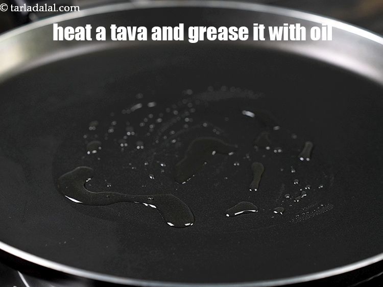 Step 25 – Heat a non-stick tava (griddle) and grease it with oil.