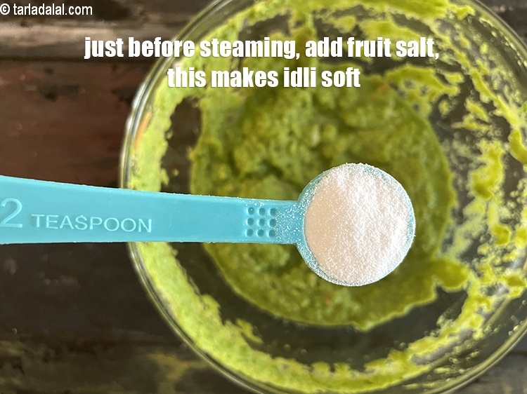Step 25 – Just before steaming, add 1 1/2 tsp fruit salt. This makes the idli soft.