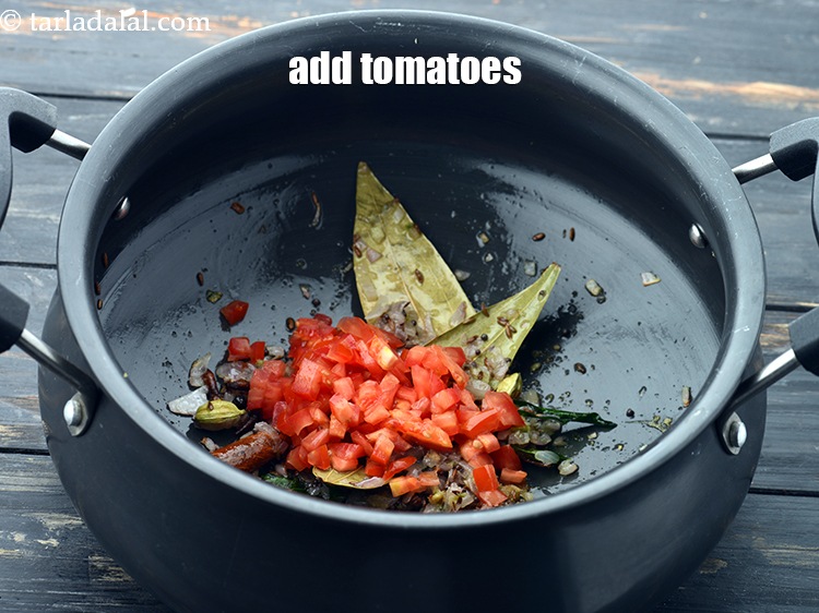 Step 26 – Add 1/4 cup&nbsp;finely&nbsp;<a href="https://www.tarladalal.com/glossary-chopped-tomatoes-779i">chopped tomatoes</a>.&nbsp;