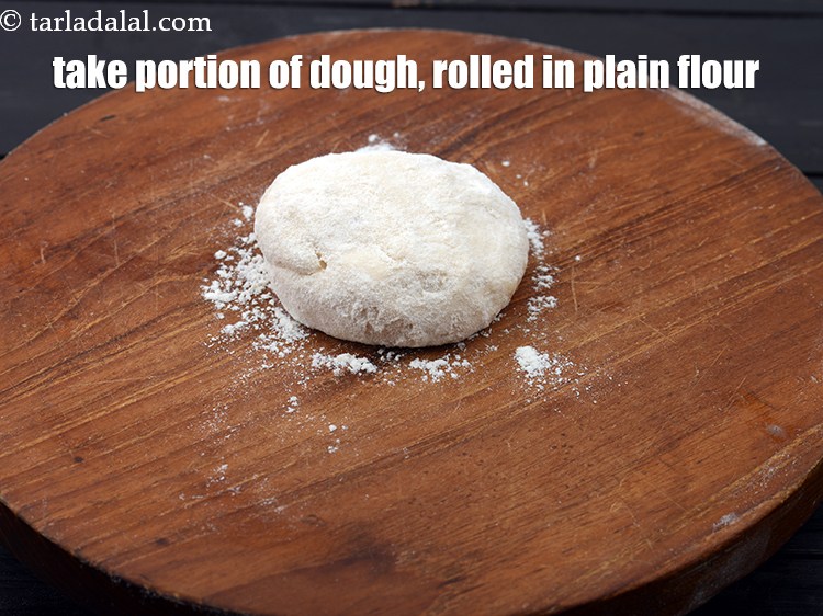 Step 27 – Take a portion of the dough, rolled in the plain flour.