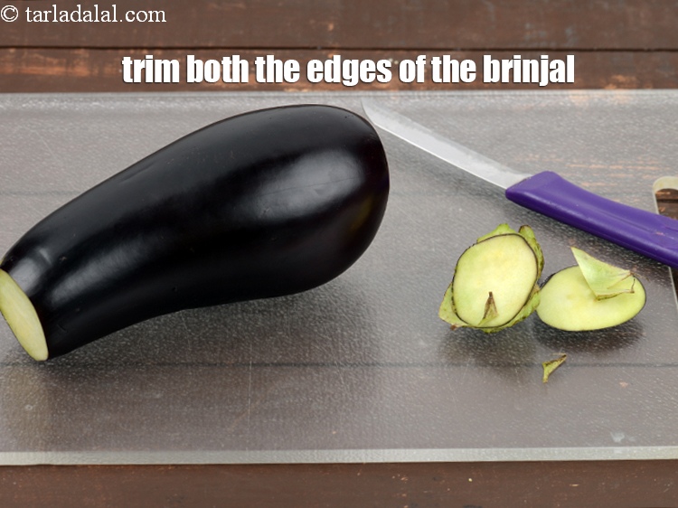 Step 26 – Trim both the edges of the brinjal.