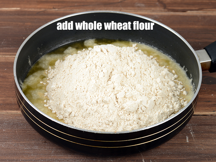 Step 25 – Add 2 cups of <a href="https://www.tarladalal.com/glossary-whole-wheat-flour-gehun-ka-atta-gehun-ka-aata-429i">whole wheat flour (gehun ka atta)</a>.