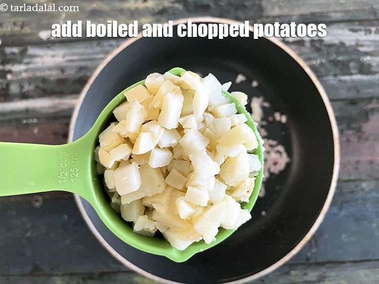 Step 36 – Add&nbsp;<meta charset="UTF-8" />1/2 cup&nbsp;<a href="glossary-boiled-and-chopped-potatoes-1879i">boiled , peeled and chopped potatoes</a>.