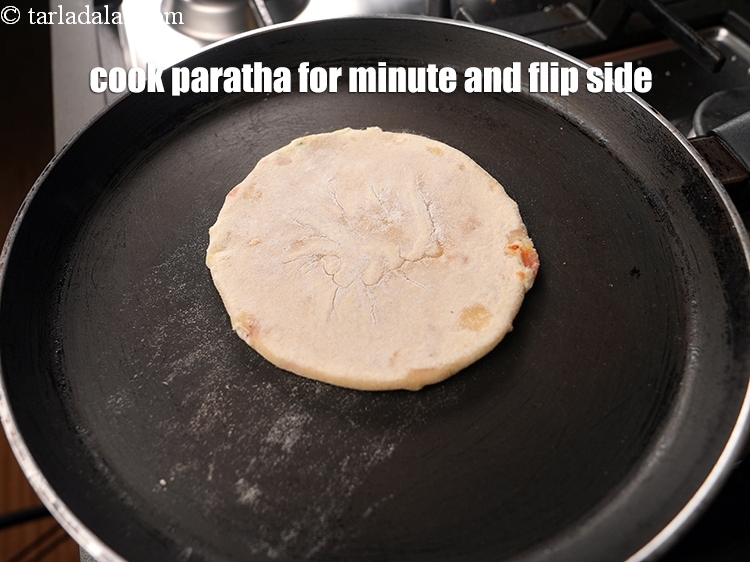 Step 25 – Cook the paratha for a minute and flip the side.