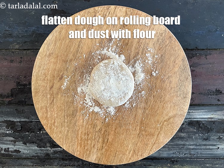 Step 27 – Faltten the dough on a rolling board and dust with flour.