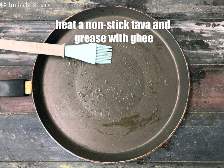 Step 32 – Heat a non-stick tava (griddle) and grease with ghee.