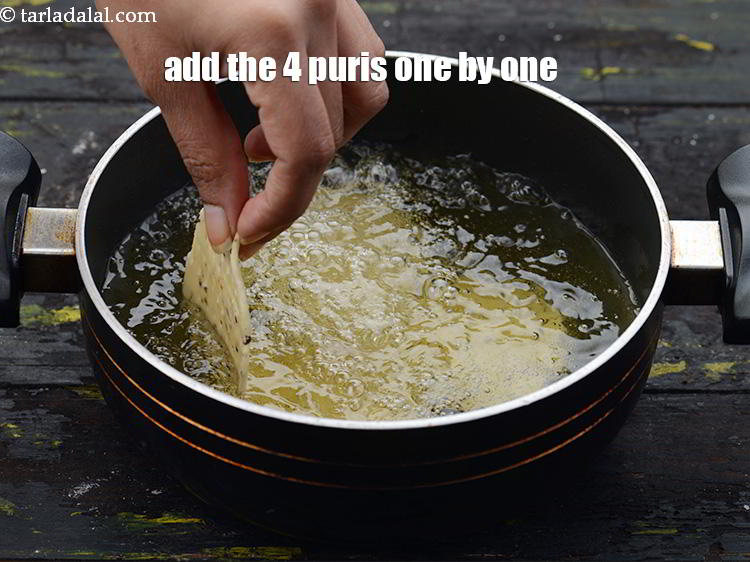 Step 27 – Once the oil is hot, add the 4 puris one by one.
