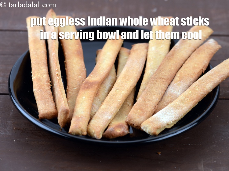 Step 28 – <meta charset="UTF-8" /> Put&nbsp;<strong>eggless Indian whole wheat sticks</strong>&nbsp;in a serving bowl and let them cool.