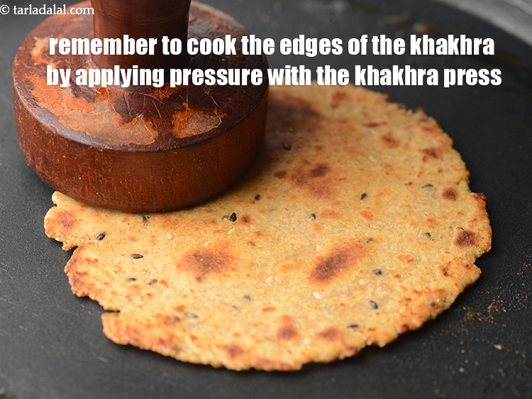 Step 23 – <meta charset="UTF-8" />Remember to cook the edges of the khakhra by applying pressure with the …