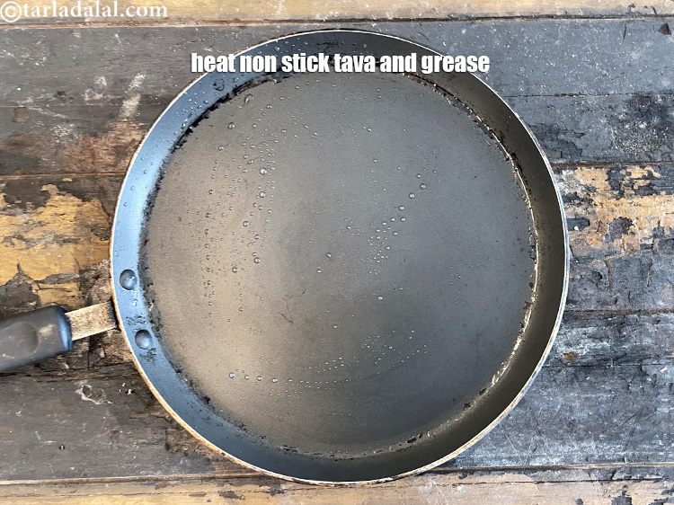 Step 26 – Heat a non-stick tava (griddle) and grease it with ghee.