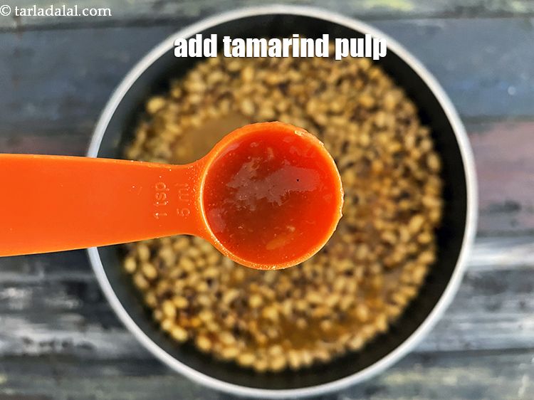 Step 27 – <p>Add&nbsp;2 tsp&nbsp;thick&nbsp;<a href="glossary-tamarind-pulp-tamarind-extract-imli-ka-pulp-838i">tamarind (imli) pulp</a>.</p>