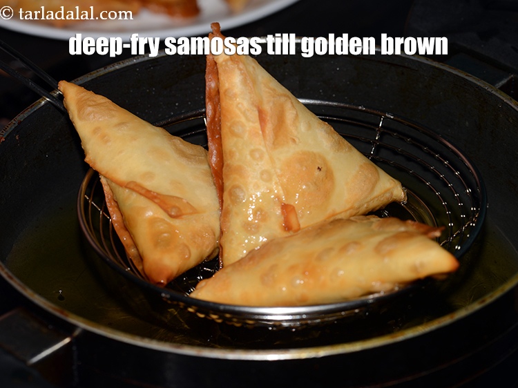 Step 25 – And deep-fry a few samosas, at a time on a medium flame, till they turn …