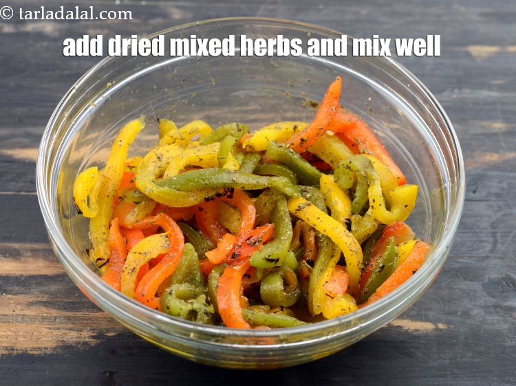 Step 26 – Add 1 tsp&nbsp;<a href="https://www.tarladalal.com/glossary-dried-mixed-herbs-466i">dried mixed herbs</a>.&nbsp;Mix well.