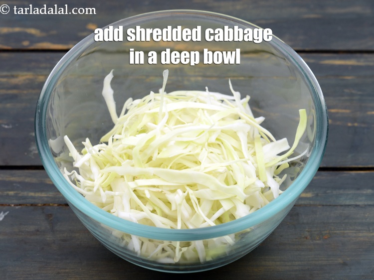 Step 26 – To make coleslaw, in a deep bowl, add 1 cup&nbsp;<a href="https://www.tarladalal.com/glossary-shredded-cabbage-763i">shredded cabbage</a>.