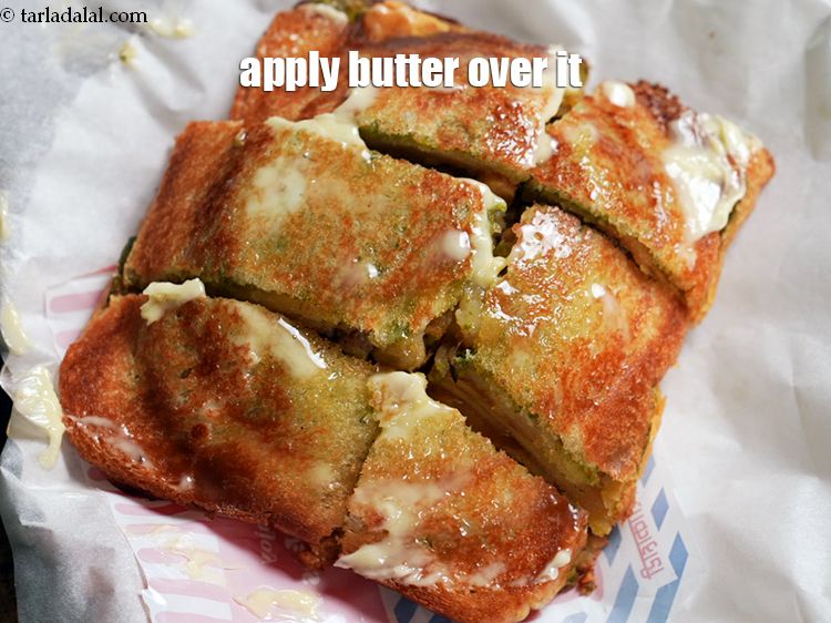 Step 27 – Apply 1 tsp of&nbsp;&nbsp;<a href="https://www.tarladalal.com/glossary-butter-makhan-233i">butter</a>evenly over it.