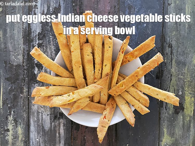 Step 25 – <meta charset="UTF-8" /> Put&nbsp;<strong>eggless Indian cheese vegetable&nbsp;sticks</strong>&nbsp;in a serving bowl and let them cool.