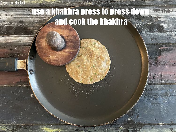 Step 26 – Use a khakhra press to press to down and cook the khakhras.