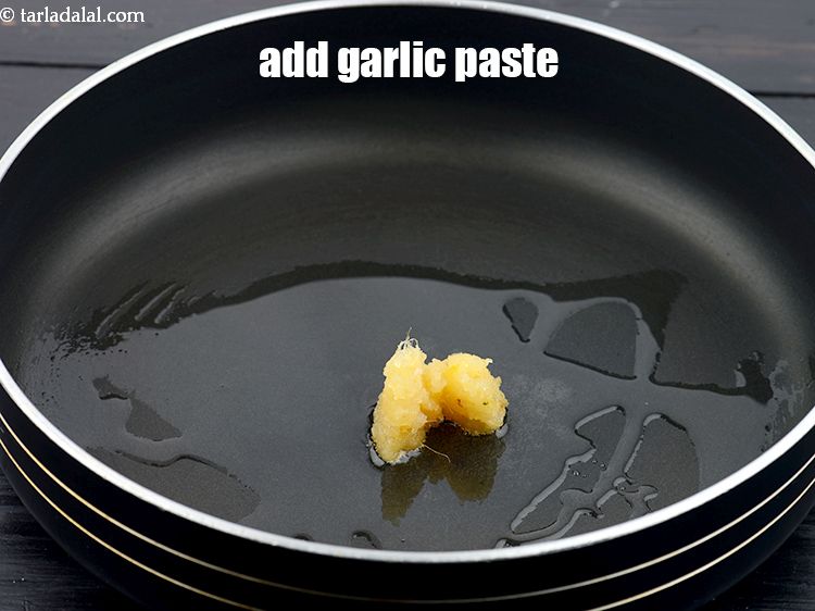 Step 26 – Add 2 tsp&nbsp;<a href="https://www.tarladalal.com/glossary-garlic-paste-lehsun-ki-paste-lahsun-ki-paste-350i">garlic (lehsun) paste</a>.&nbsp;