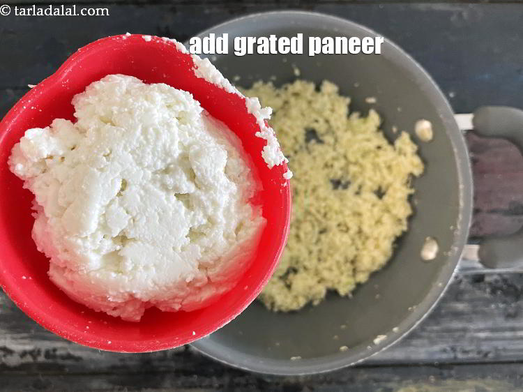 Step 25 – Add&nbsp;<meta charset="UTF-8" />3/4 cup&nbsp;<a href="glossary-grated-panee-1003i">grated paneer (cottage cheese)</a>.