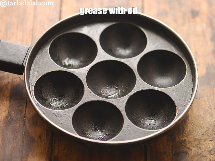 Step 34 – To make <strong>chawli moong dal appe recipe&nbsp;|&nbsp;chaulai appe&nbsp;|&nbsp;healthy appe&nbsp;|&nbsp;amaranth leaves appe,&nbsp;</strong>grease an appe mould with …