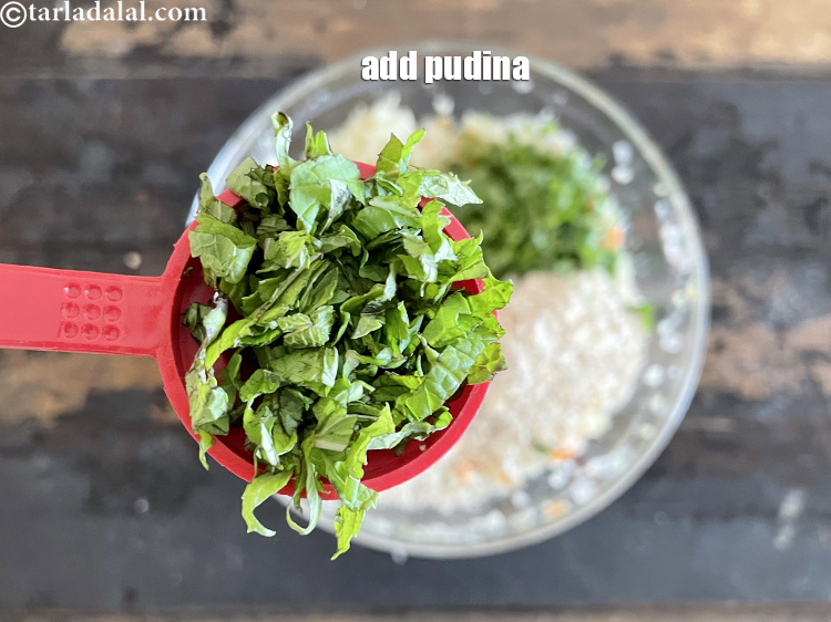 Step 27 – Add&nbsp;<meta charset="UTF-8" />2 tbsp&nbsp;finely&nbsp;<a href="glossary-chopped-mint-788i">chopped mint leaves (phudina)</a>.