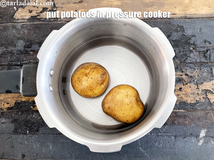 Step 37 – Put 2 potaotes in a pressure cooker. Fill enough water to almost cover the potatoes.