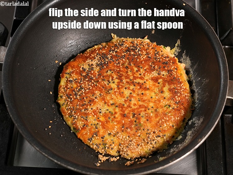 Step 33 – Flip the side and turn the handva upside down using a flat spoon.