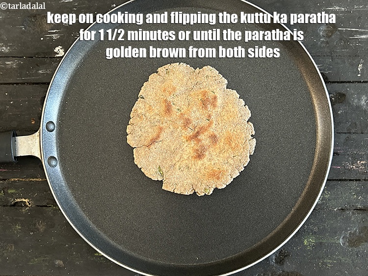 Step 26 – <meta charset="UTF-8" /> Keep on cooking and flipping the&nbsp;kuttu ka paratha&nbsp;for 1 1/2 minutes or …