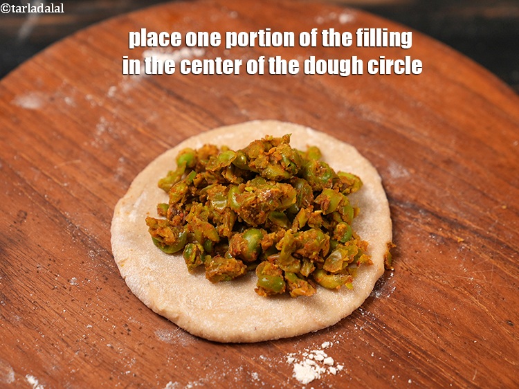 Step 27 – Place one portion of the filling in the center of the dough circle.&nbsp;