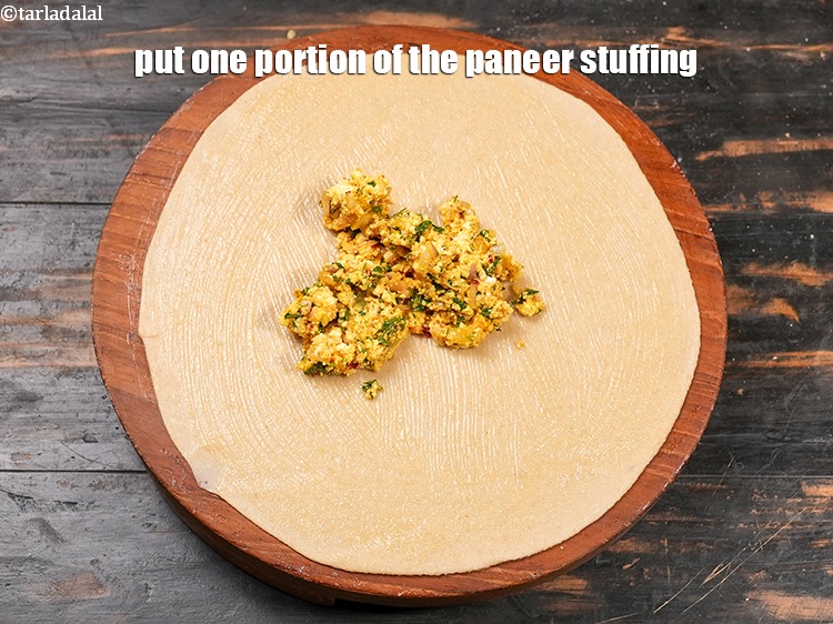 Step 26 – Put one portion of the paneer stuffing.