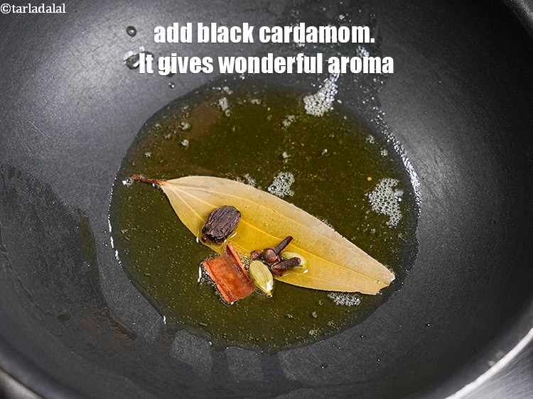 Step 26 – Add 1 <a href="https://www.tarladalal.com/glossary-black-cardamom-badi-elaichi-moti-elaichi-263i">black cardamom (badi elaichi)</a>. It gives wonderful aroma.
