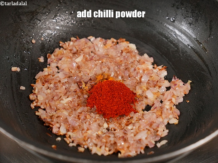 Step 26 – Add &frac12; tsp <a href="https://www.tarladalal.com/glossary-chilli-powder-red-chilli-powder-339i">chilli powder</a>.
