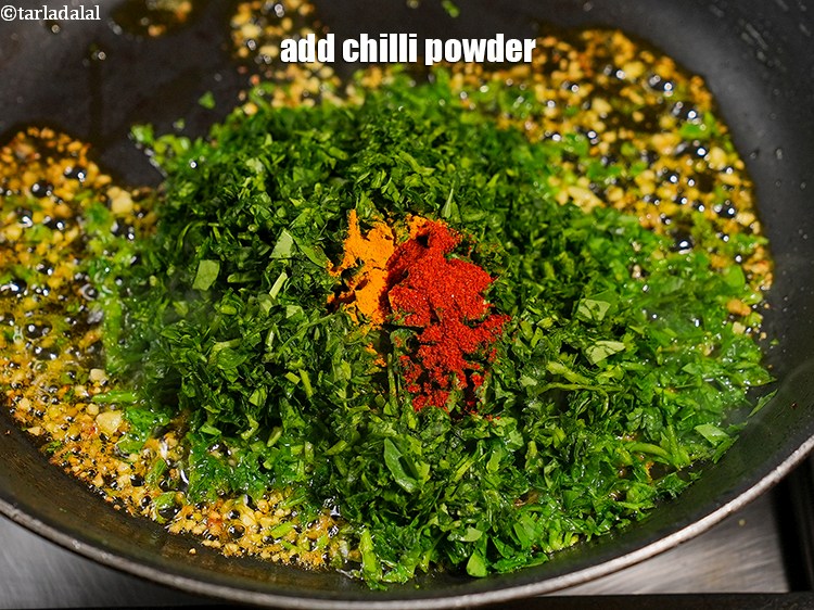 Step 26 – Add &frac14; tsp <a href="https://www.tarladalal.com/glossary-chilli-powder-red-chilli-powder-339i">chilli powder</a>.