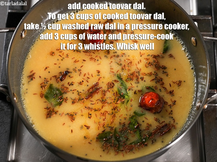 Step 26 – Add 3 cups <a href="https://www.tarladalal.com/glossary-soaked-and-cooked-toovar-dal-1929i">cooked toovar (arhar) dal</a>. To get 3 cups of cooked toovar …