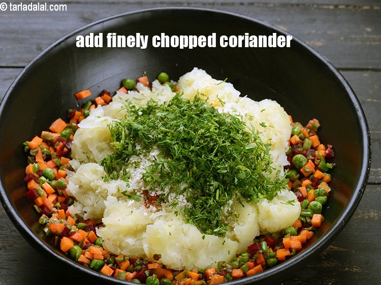 Step 27 – Add 2 tbsp finely&nbsp;<a href="https://www.tarladalal.com/glossary-chopped-coriander-783i">chopped coriander (dhania)</a>.&nbsp;