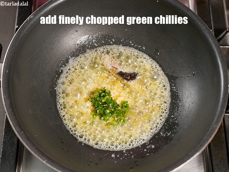 Step 26 – Add 1 tsp finely <a href="https://www.tarladalal.com/glossary-chopped-green-chilli-820i">chopped green chillies</a>.&nbsp;